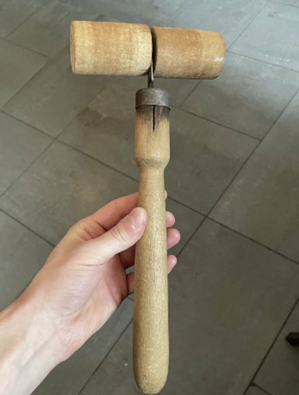 "A strange tool with a rotating head — it’s like a wooden hammer/roller, but what would it be used for?"

“Looks like this. It seems to be part of an antique or retro Swedish berry/fruit press.”