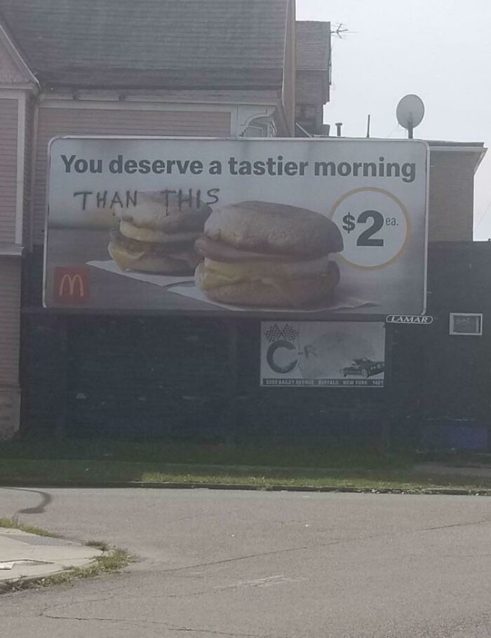 Funny vandalism - billboard - You deserve a tastier morning Than This E lea. $20. Cr Bisegakay Aftice Puffalo New York 1421 Clamar