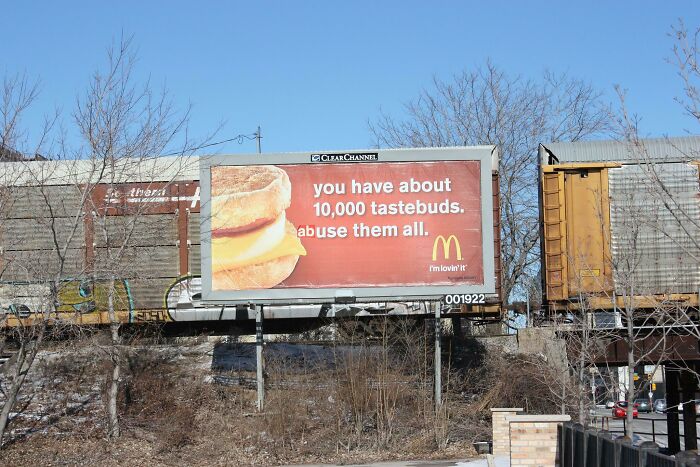 Funny vandalism - billboard - thera Clear Channel you have about 10,000 tastebuds. abuse them all. M I'm lovin' it 001922 Raam