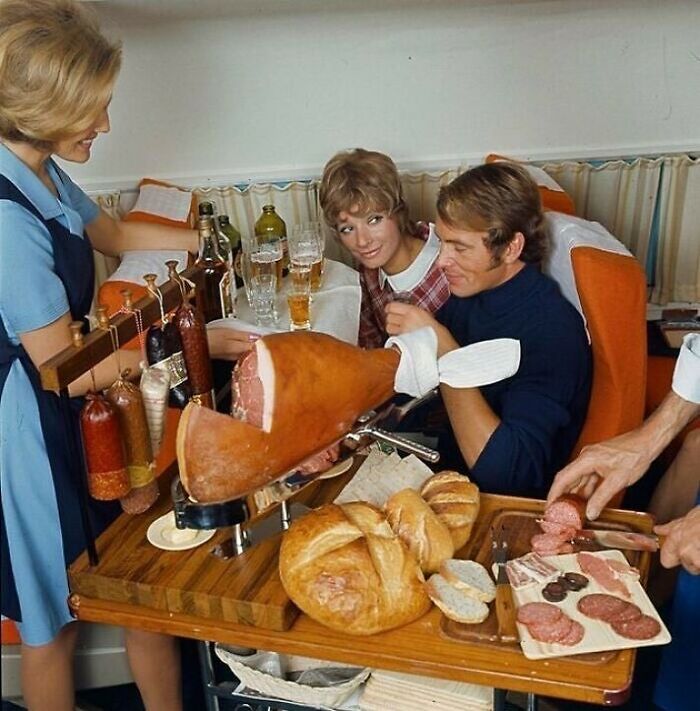 fascinating historical photographs - serving a snack on scandinavian airlines flight