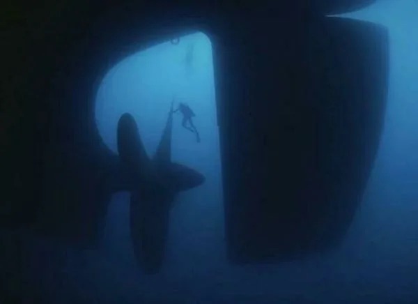 huge versions of ordinary items - ship propeller underwater