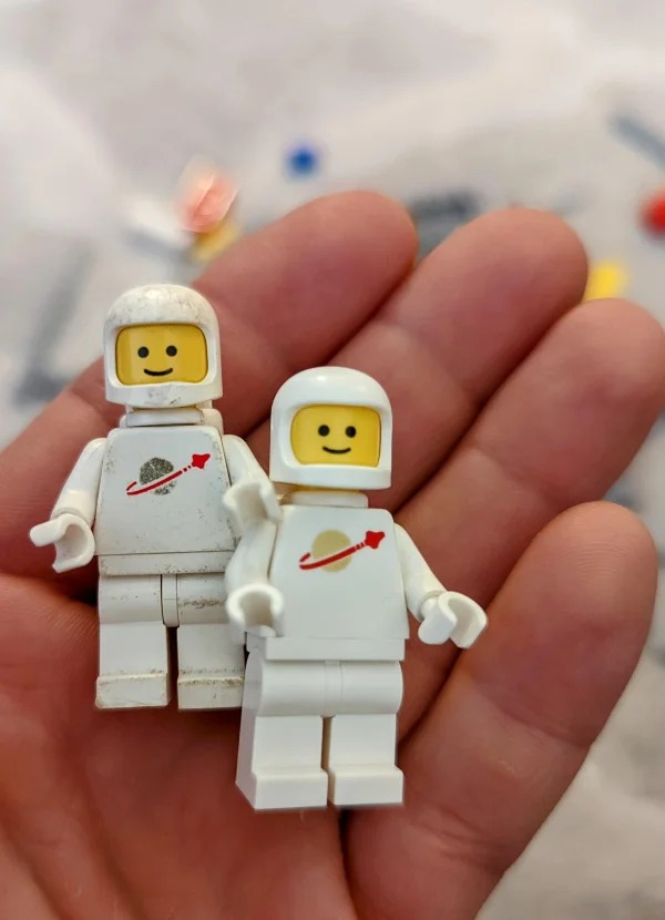 “a Lego space figure from 1980 and one from 2022.”