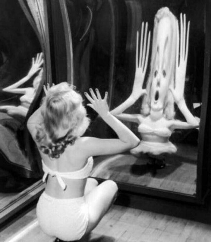 cool pics from history --  reflection funhouse mirror
