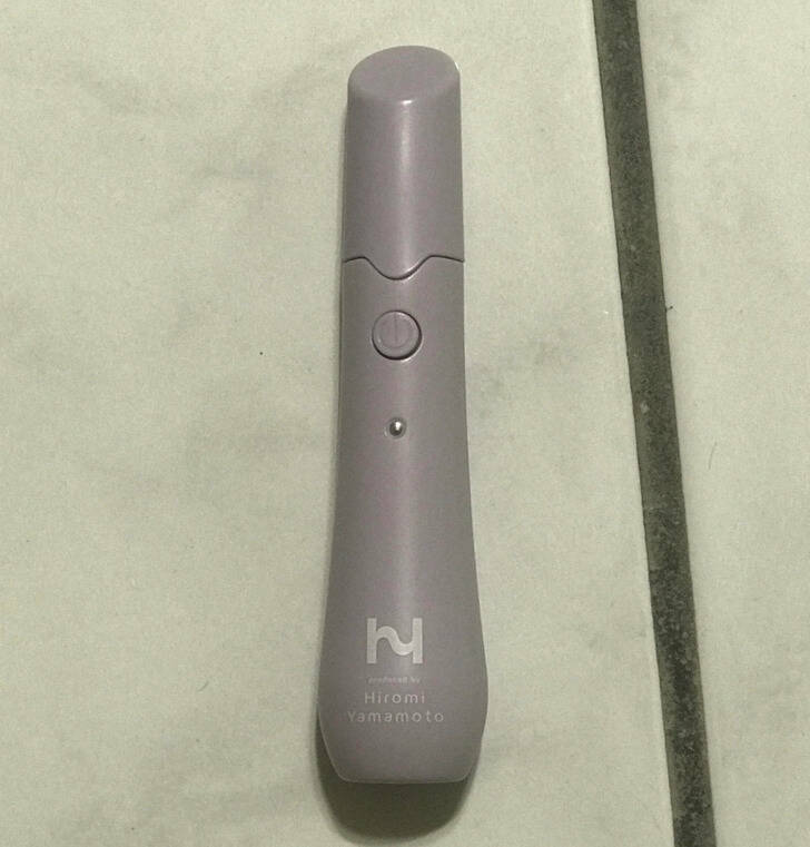 ’’4- to 5-inch lipstick-like item with a logo and “Produced by Hiromi Yamamoto” underneath. One AAA battery, doesn’t function.’’

’’Some electric skin care massager/treatment wand.’’