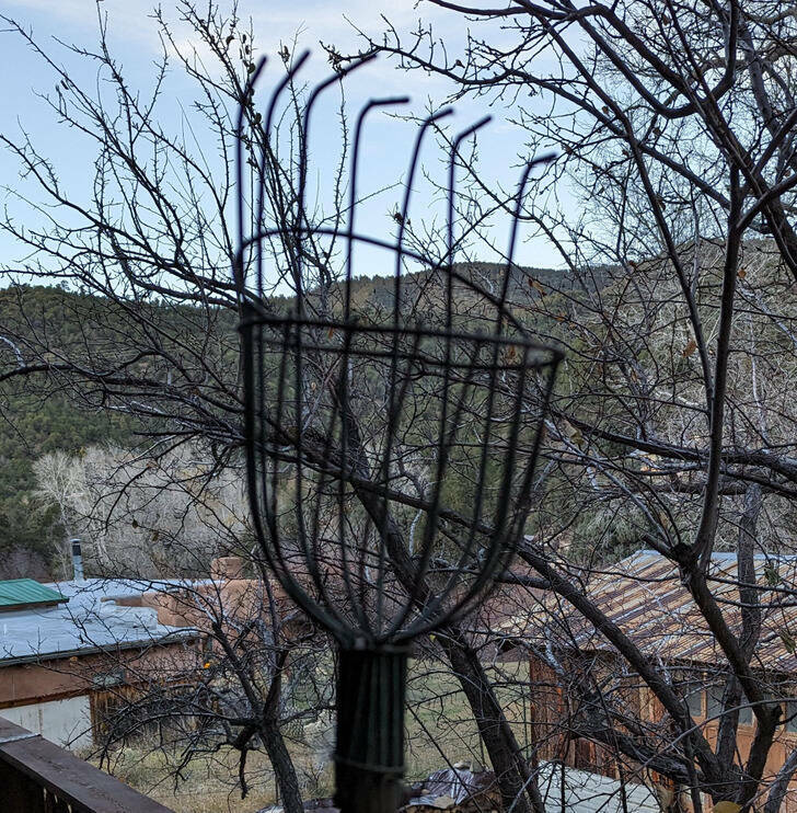 ’’This has a long handle like a shovel, but on the end, it looks like a sort of basket/rake thing?’’

’’Definitely a telescoping fruit picker.’’