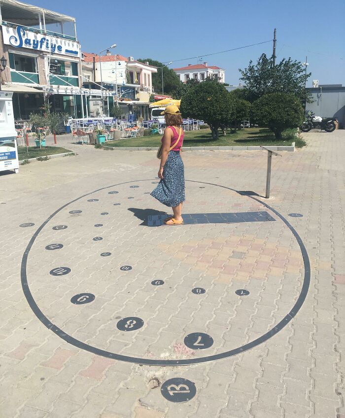 A Clock That Shows Time By Using The Shadow Of The Person Who Stands On The Current Month