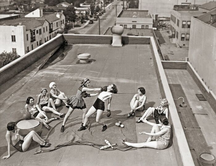 historical photographs - women boxing on a roof