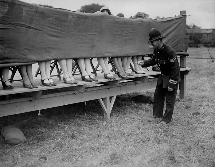 A Policeman Judges An Ankle Competition At Hounslow, London, 1930