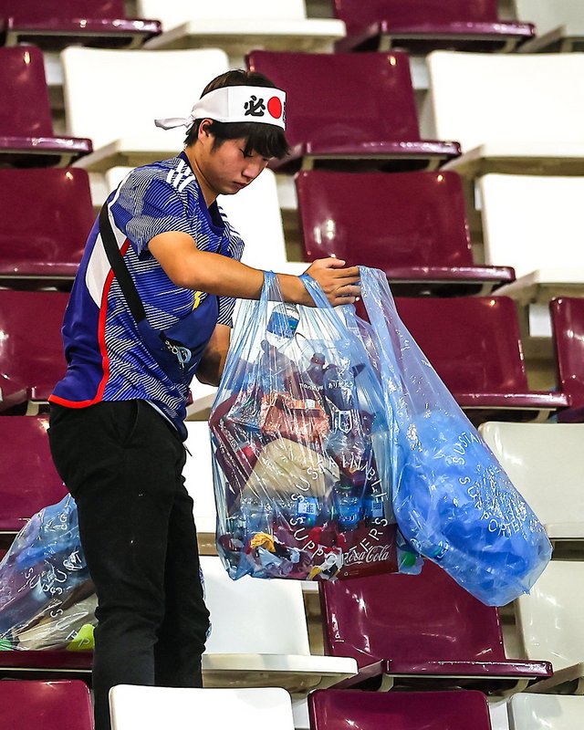 Even after a famous win at the World Cup, Japan fans stayed behind to clean up