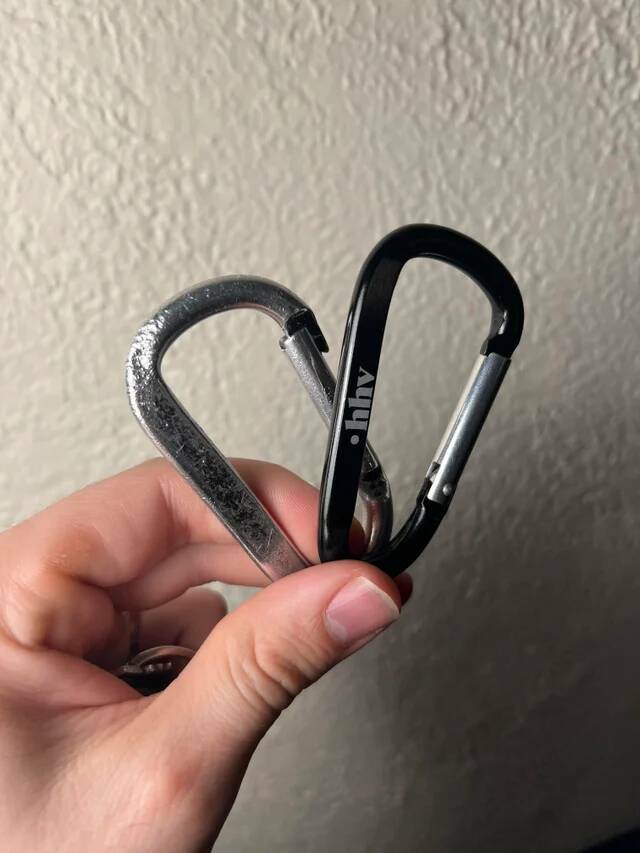 "Old and new keychain carabiner after a decade. The original started all black, and the chew marks are from using it as my primary bottle opener."