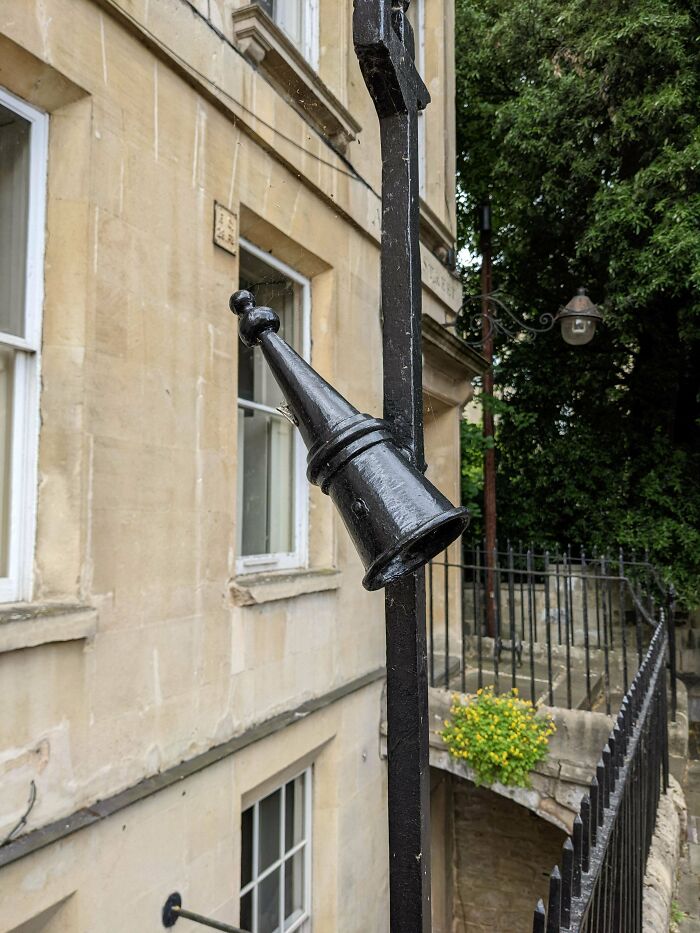 Iron Cone On Either Side Of A Gate Outside The Entry To A Building In Bath England.
Answer: It's a snuffer. A visitor to your house would use it to put out their torch.