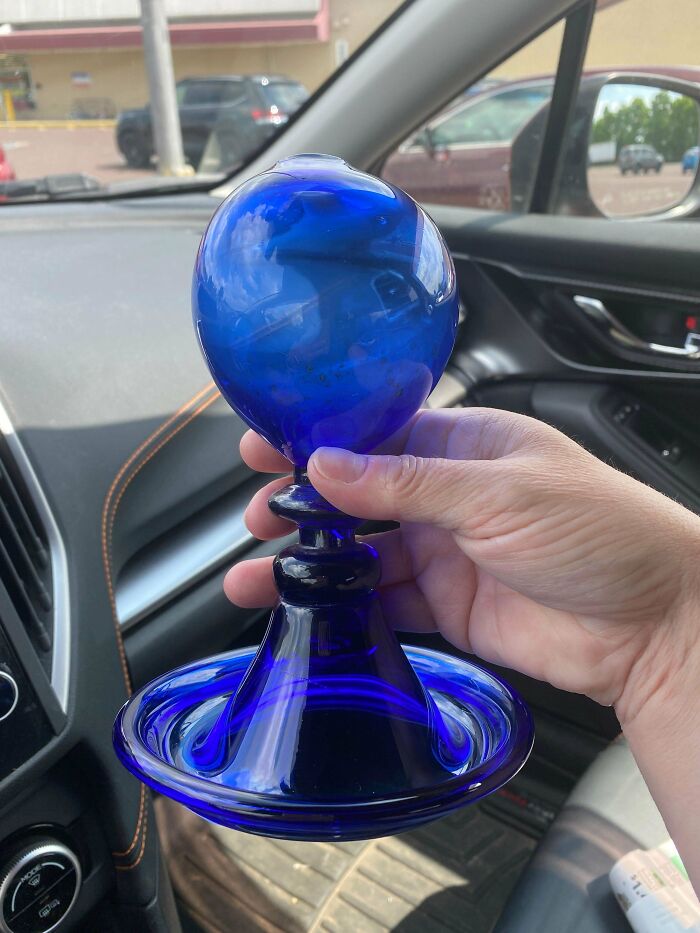 Blue Glass Thing Found At Goodwill. About 5 Inches High With A Hole In Top.
Answer: That is a whale oil lamp. Hand blown glass. Very odd blue color. Not cheap !