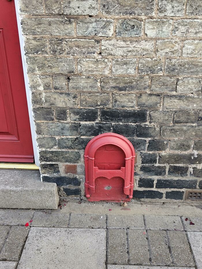 What Is This Hatch I've Seen On The Outside Of Houses In The UK?
Answer: It's a boot scraper, for getting the mud off your shoes before going in. They are pretty common.