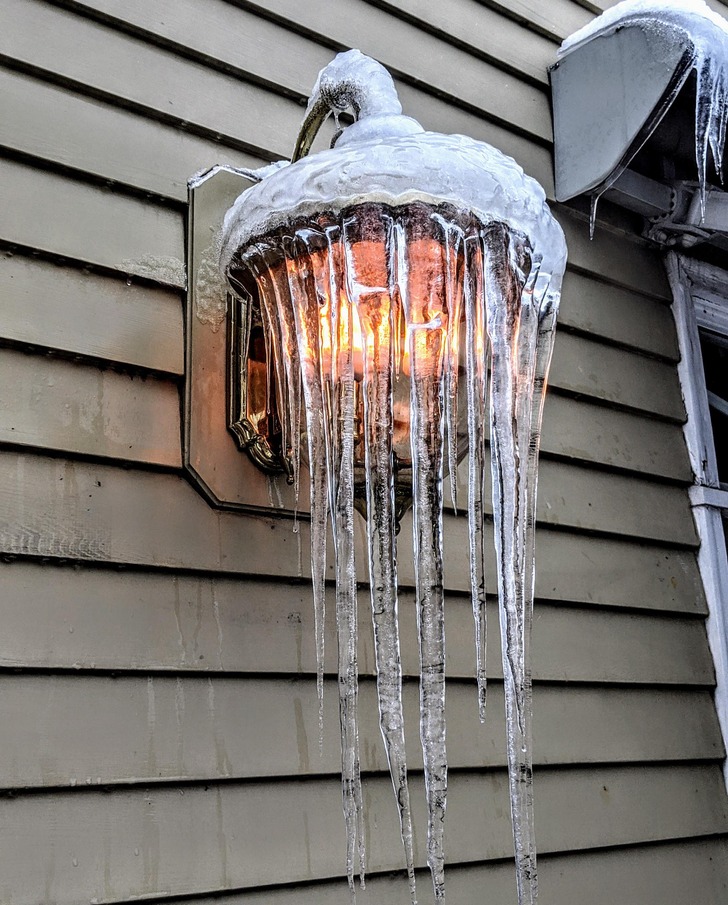 “A lit, iced-over lamp”