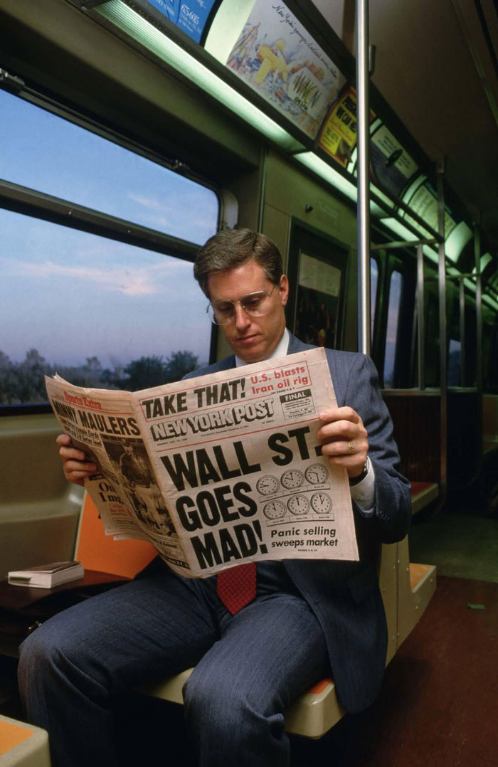 A Commuter Reads The New York Post’s Rundown Of Black Monday Stock Market Crash, 1987
