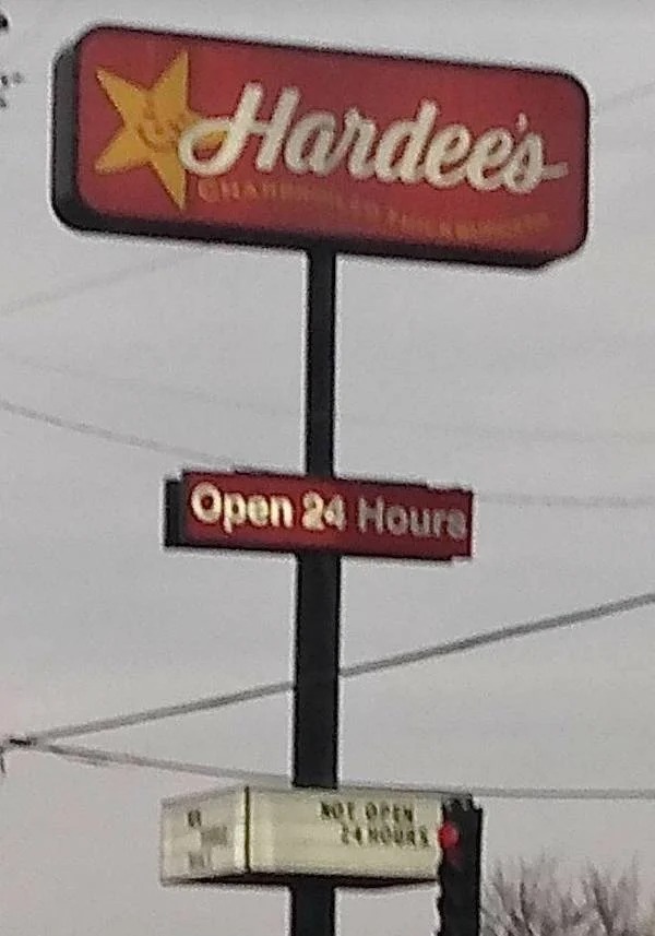 things that are depressing - street sign - Hardee's Open 24 Hours Not Open 24 Novas