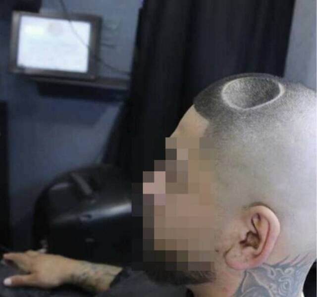 This haircut that makes it look like there's a pothole in this guy's head: