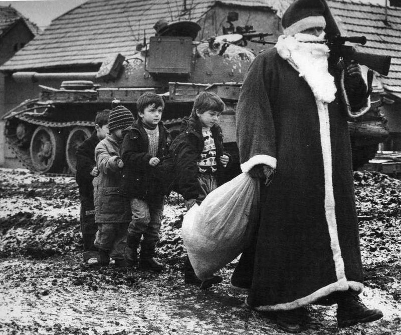 Santa Claus with the children during Croatian War. Vukovar, 1992