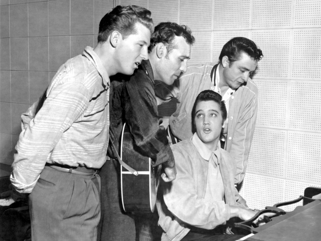 Rock and roll musicians Jerry Lee Lewis, Carl Perkins, Elvis Presley and Johnny Cash as “The Million Dollar Quartet”. This was a one night jam session at Sun Studios (Memphis, Tennessee 1956)