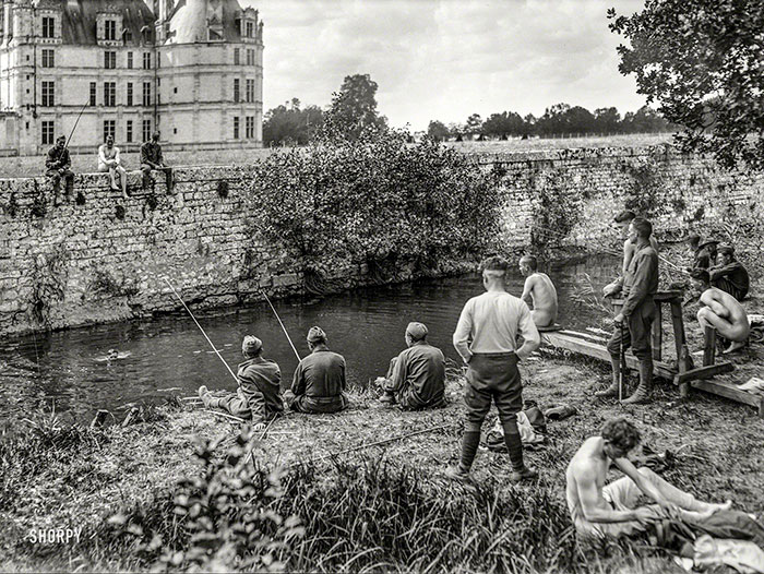 Patients having a happy time fishing and swimming under the walls of the old chateau. These American soldiers are recovering from war neurosis, as the scientists now call the condition that used to be described as ‘shell-shock.’ September 1918