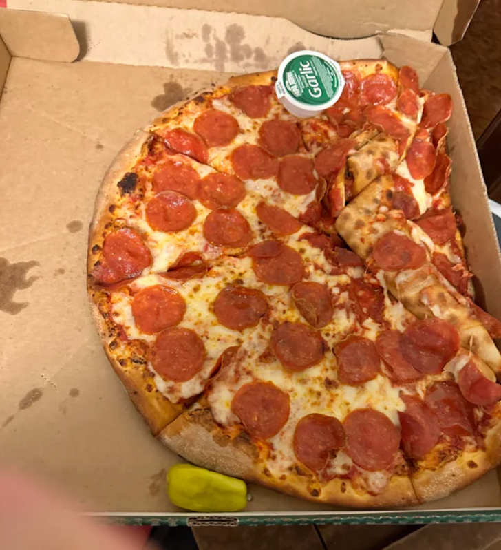 “Someone clearly dropped the pizza, but neither place will refund!”