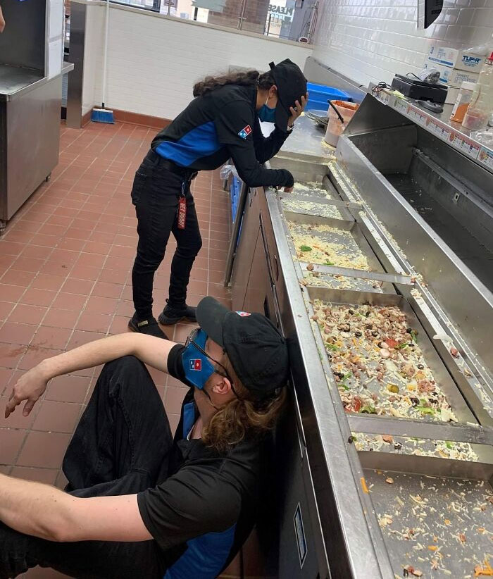 people having a bad day at work - domino's workers exhausted