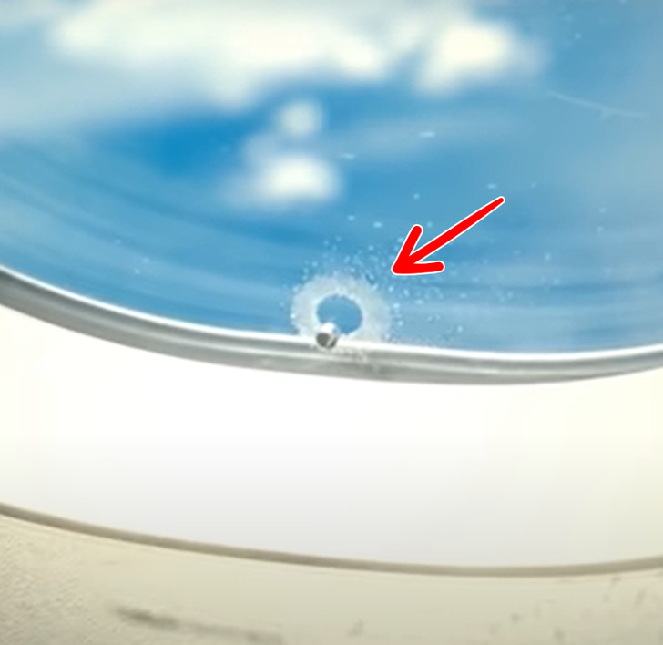 It’s okay that plane windows have a hole in them. This tiny hole in plane windows is not dangerous, so there’s no need to worry. It’s there to balance air pressure because the window has 3 layers. The hole itself is in the middle and is needed during take-off and landing to avoid fogging.