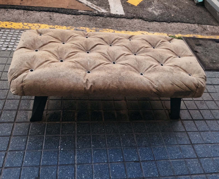 “A tufted style bench but made of concrete”