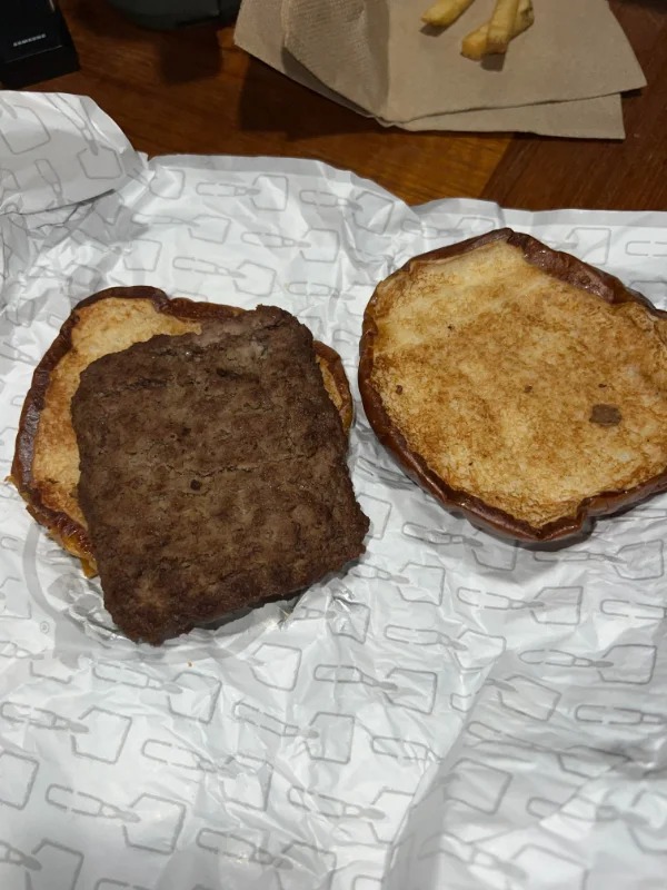 “Thought I was ordering a burger with “warm beer cheese sauce, Applewood smoked bacon, smoky honey mustard, crispy fried onions, pickles, and a slice of muenster cheese on pretzel bun.” But apparently you have to select all of the ingredients individually on Grubhub. Oh and a two hour wait + overpaid.”