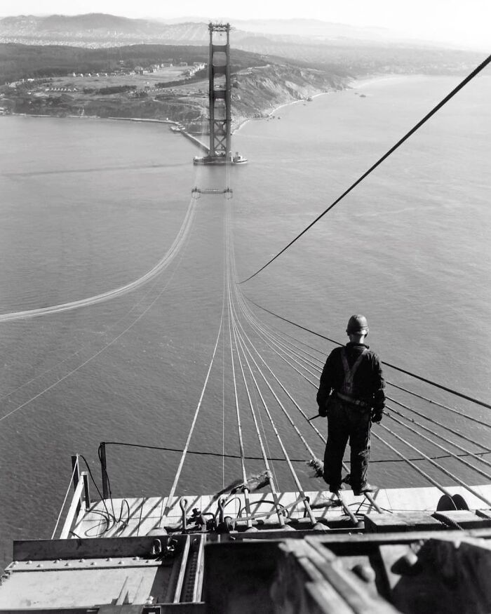 A Man Standing On The First Cables During The Construction Of The Golden Gate Bridge, With The Presidio And San Francisco In The Background. 1935.