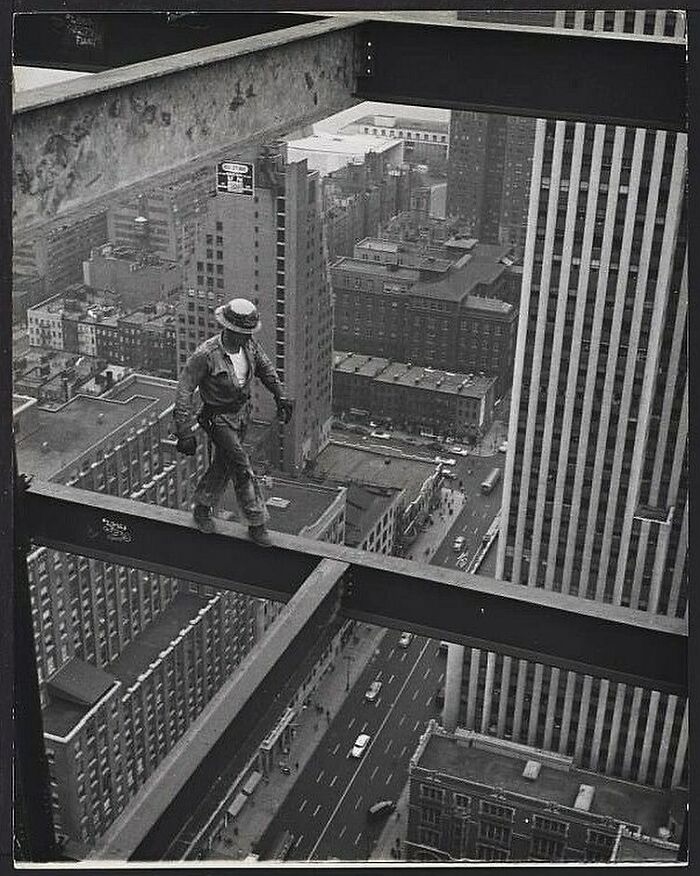 A New York Construction Worker Walks Along A Girder High Above The City Streets, 1950.