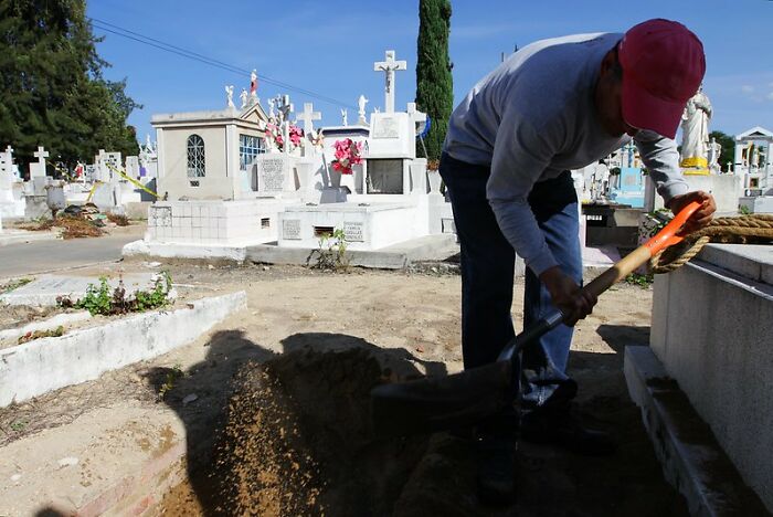 I am a grave digger. No, I don't dig the grave with a shovel.