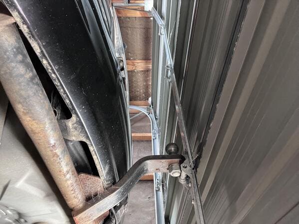 “Garage door is stuck on my tow bar and won’t open. Absolutely no idea how to get it unstuck.”