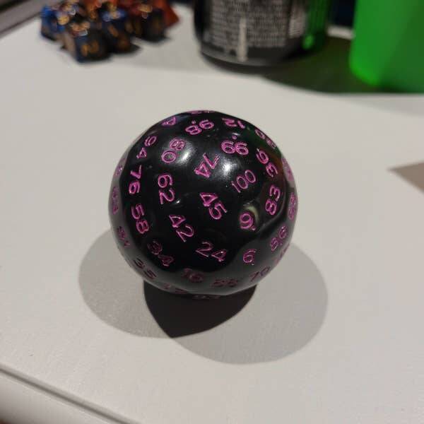 This is what a 100-sided die looks like: