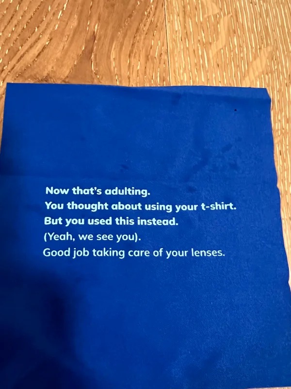 On the back of the microfiber cloth that came with my glasses.