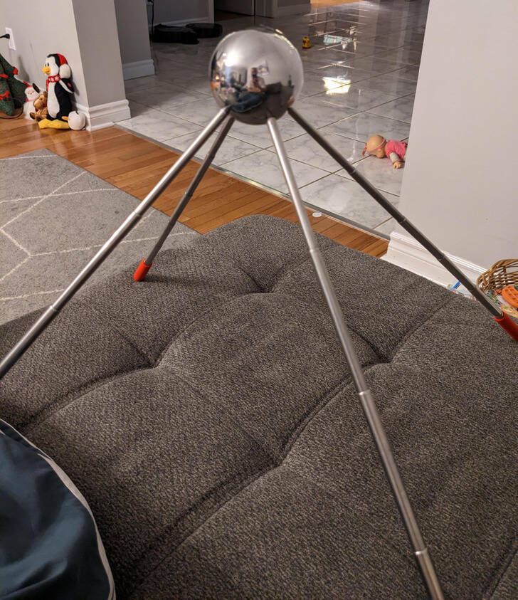 “This metal sphere has 4 telescopic arms and nothing else, no markings either.”

“I think it’s one of these phone holders.”