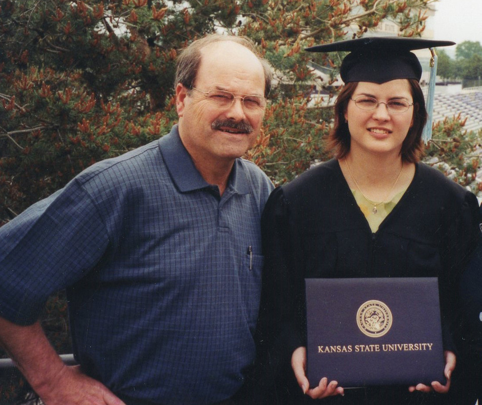 Father poses with daughter at her graduation.
The father, Dennis Rader, also known as the BTK Killer, had killed 10 people over the span of about 25 years.
