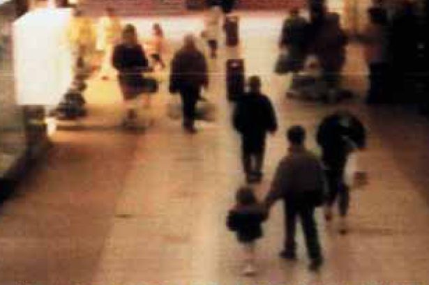 Surveillance photo of a mall in England.
The toddler in this picture is James Bulger. He was abducted, tortured and murdered by two ten-year-old boys, Robert Thompson and Jon Venables. His mutilated body was found on a railway line two-and-a-half miles away in Walton, Liverpool, two days after his murder.