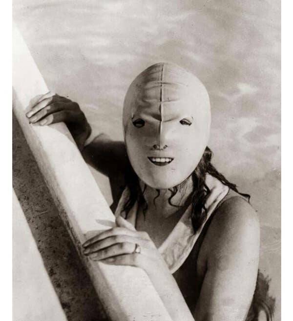 In the 1920s, some people used to wear face-covering swim masks, ostensibly to protect their skin from the sun's rays and not terrify the children during adult swim: