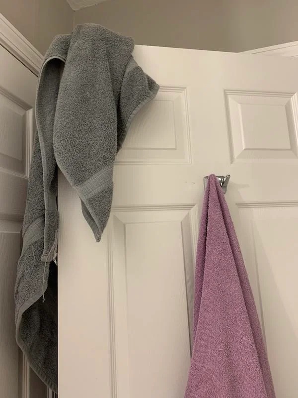 My bf keeps hanging towels on the door frame when the hook is right there.