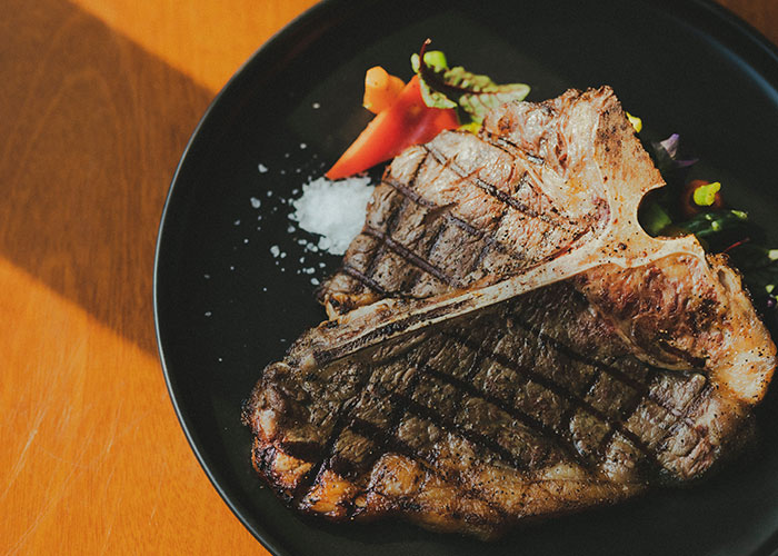 South Side Chicago: There was some kid munching down on a T-Bone steak in class. The succulent, delicious meat was distracting the other students, so they sent him to the office to finish it off! Unclear if he was going for the name "T-Bone". No idea how this errant T-Bone was obtained, but it look and smelled like it was freshly made.