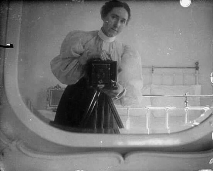 A Young Victorian Lady Photographing A Mirror Selfie. Circa 1900