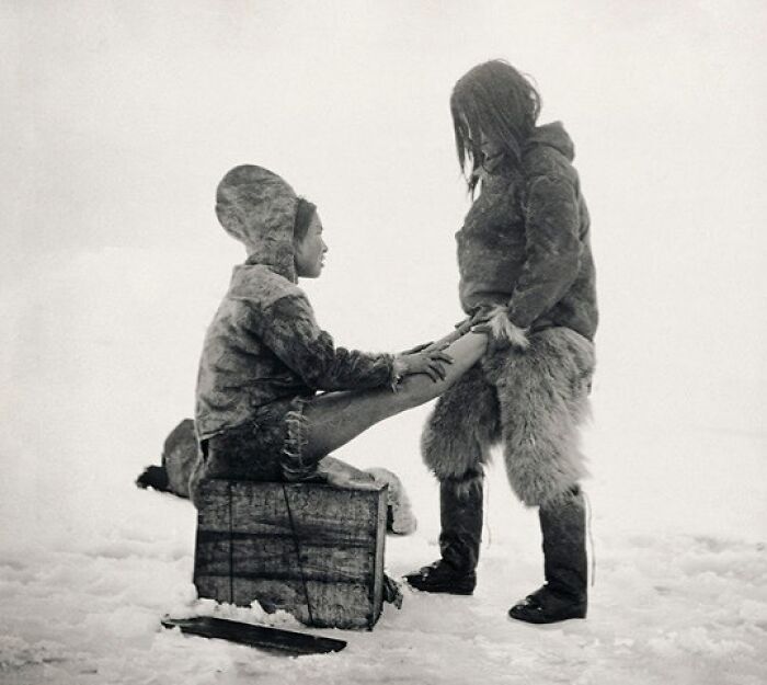 Autremagazine 1890s, An Inuit Man Warms His Wife’s Feet. Greenland