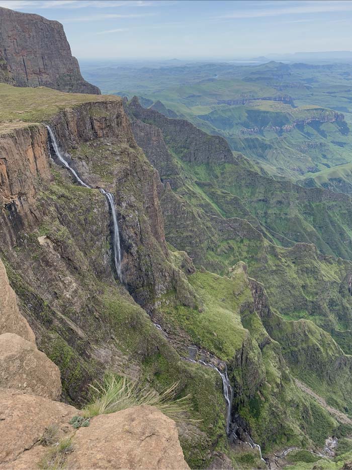 In the KwaZulu-Natal Province of the Republic of South Africa, the Drakensberg of Royal Natal National Park is home to the complex of seasonal waterfalls known as Tugela Falls. With an uninterrupted leap of 411 m (1348.43 ft) and a total drop of 947 m (3106.96 ft), it may be the tallest waterfall on Earth, according to some measurements.