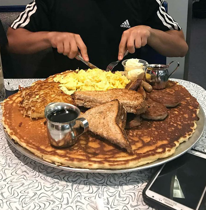 This Giant Pancake. It's Part Of A Food Challenge At This Place Called Nicolette Diner In Minneapolis