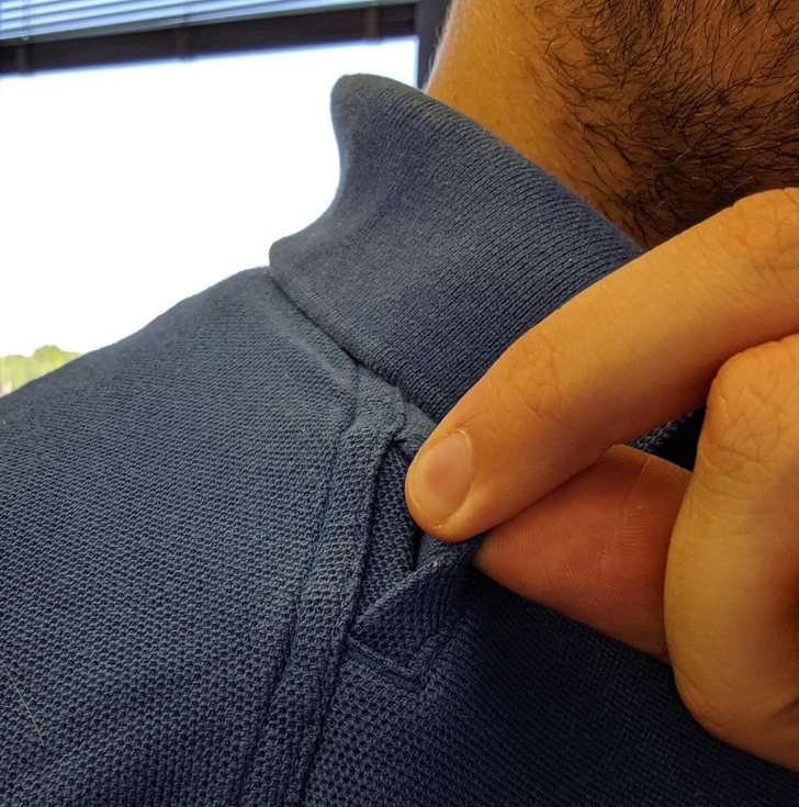 The little finger-length pocket next to the collar of a shirt is not just a random design choice. In fact, it actually serves a specific purpose. It’s called a shoulder mic clip and is often used by people in the law enforcement, security, or military professions. The clip is designed to hold a microphone close to the wearer’s mouth, allowing for better communication during radio transmissions.