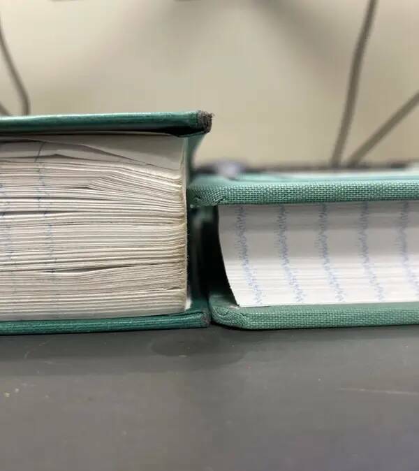 A log book used daily vs. an unused log book:
