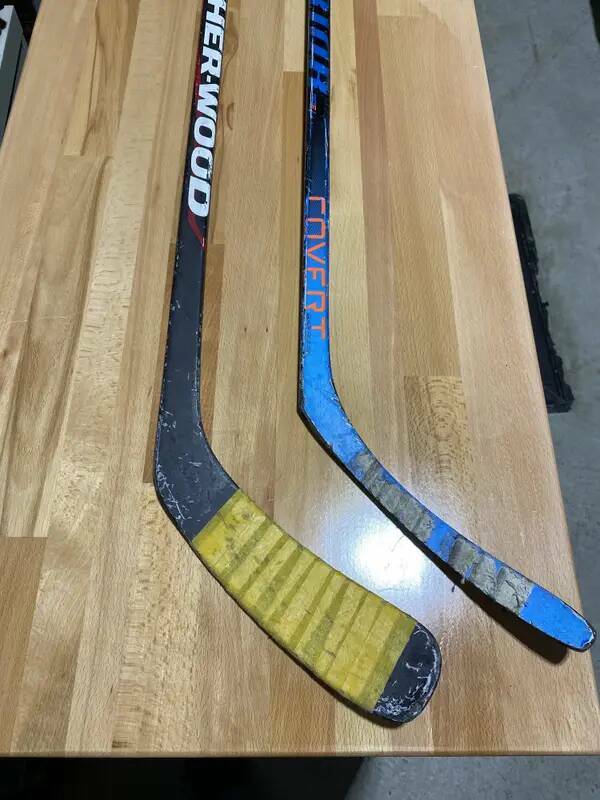 A much newer hockey stick vs. a hockey stick that shall stick no more soon: