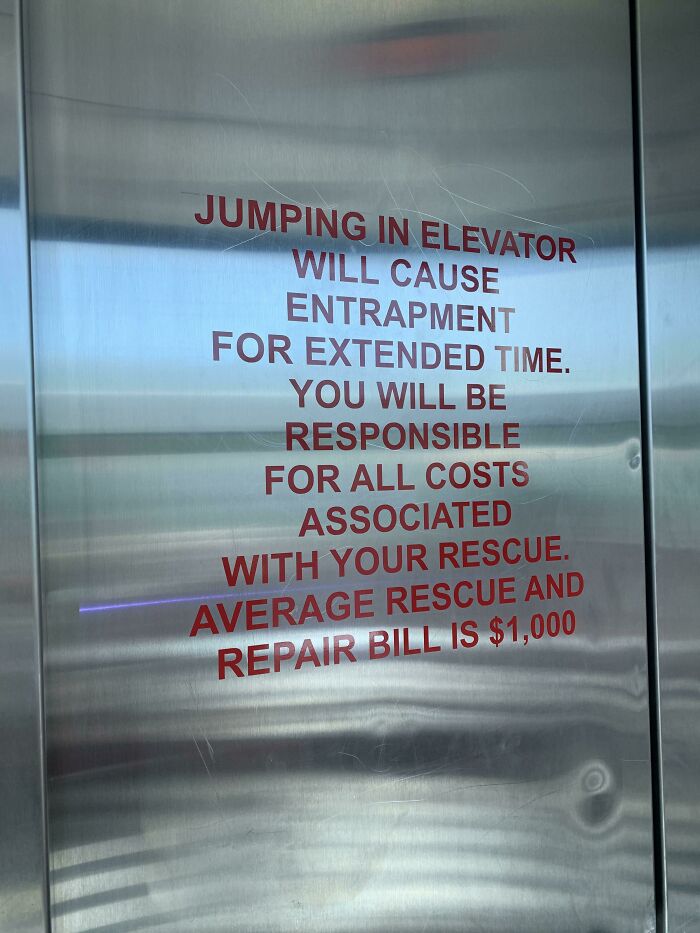 work safety fails - signage - Jumping In Elevator Will Cause Entrapment For Extended Time. You Will Be Responsible For All Costs Associated With Your Rescue. Average Rescue And Repair Bill Is $1,000