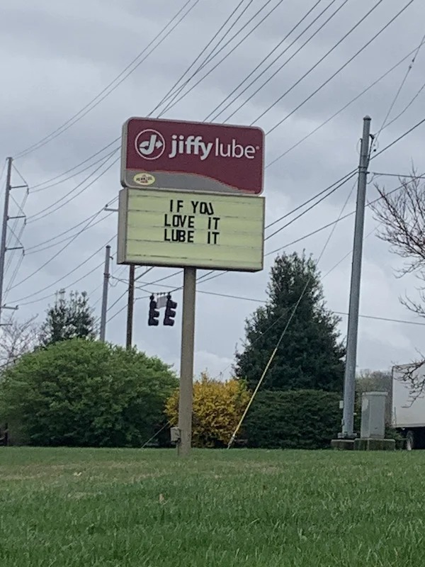street sign - Jjiffy lube If You Love It Lube It Ee